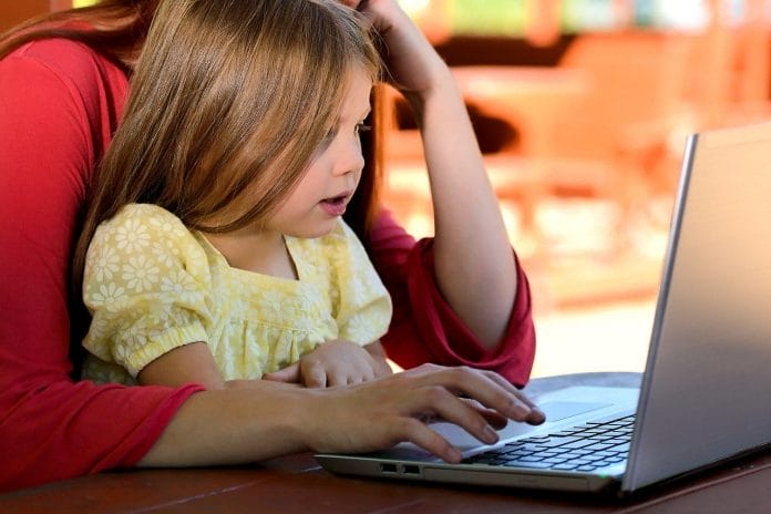 child watching laptop